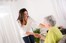 private home care for seniors woman shaking hands with senior
